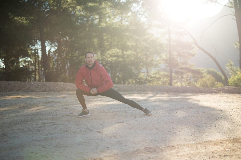 A man is exercising in a park